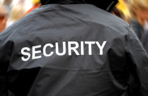 bigstock-Security-Guard-Back-6008755-300x196